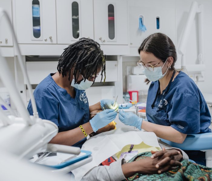 Dr. Salematou Camara, Dentist, with a patient.