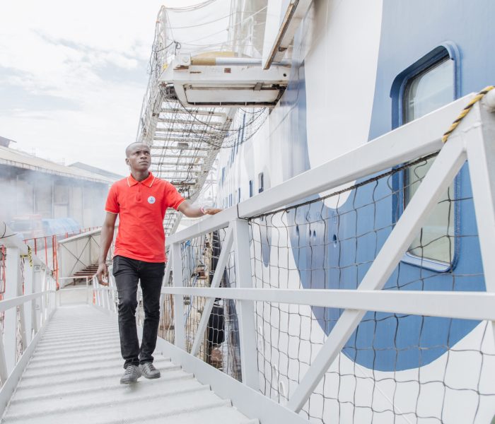 ahr, the first patient of the 2024-25 field service in Sierra Leone, boarding the Global Mercy to be admitted for surgery.