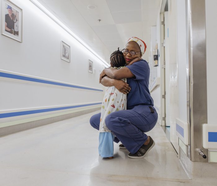 Tina Seyi-Olajide, Pediatric Surgeon, with Marion, general patient, after ward rounds.
